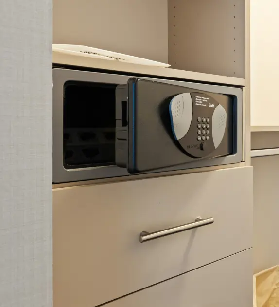 Open safe door in a closet.